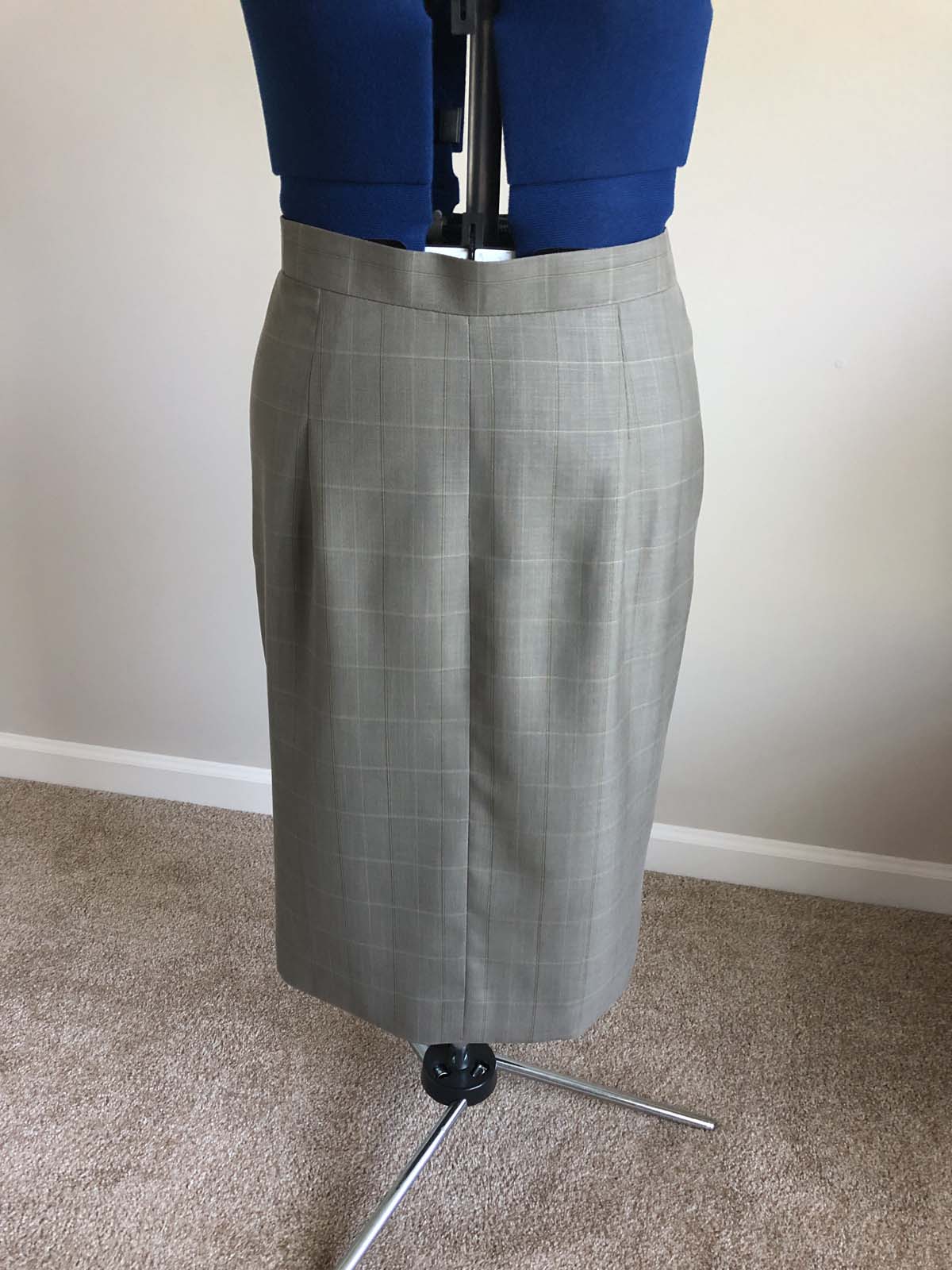 Finished skirt front, on dress form; skirt created from men's suit pants