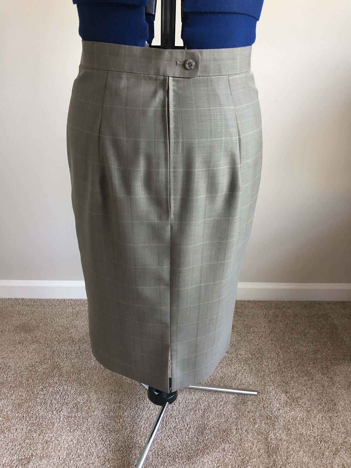 Finished skirt back, on dress form; skirt created from men's suit pants