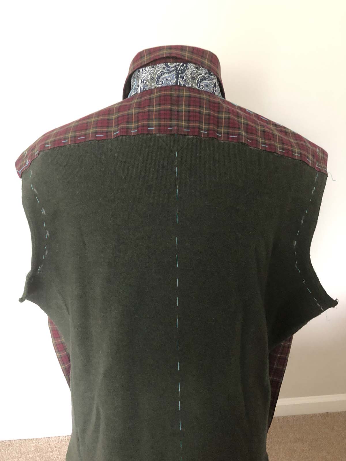 Sew the sweater back to the red plaid shirt back yoke