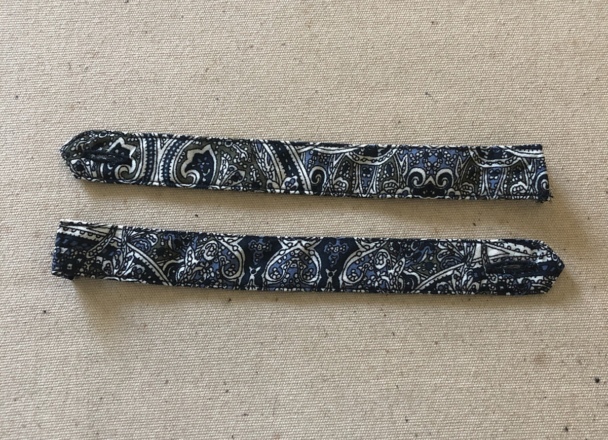 Paisley print sleeve tabs from original blouse were not used for the upcycle project