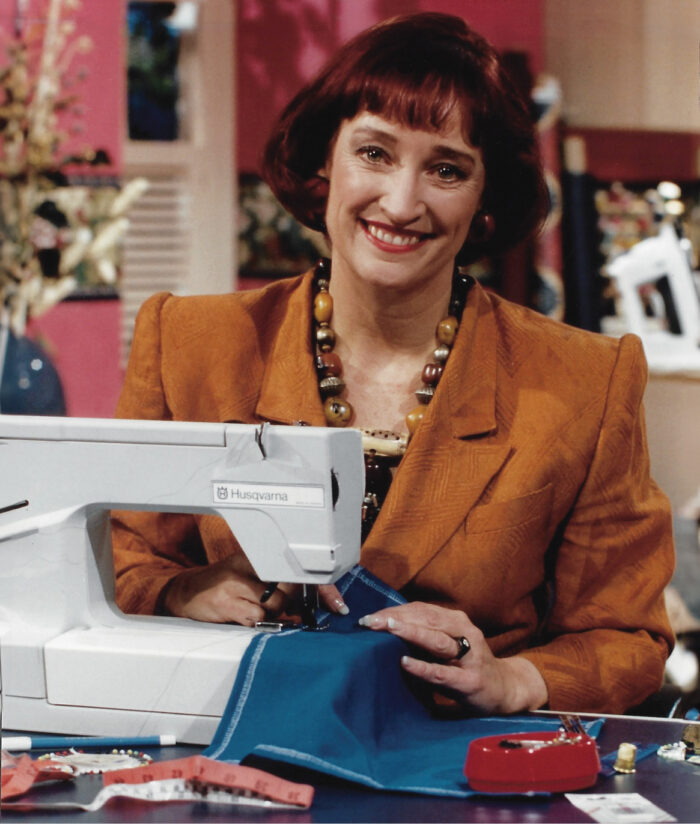 Sandra Betzina sitting in front of a sewing machine.