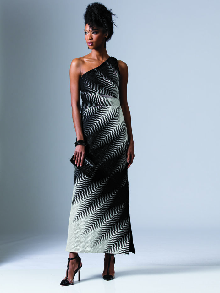 model wears a graphic black-and-white print, flor-length dress.