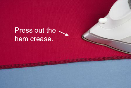 Remove the original stitching and press out the hem