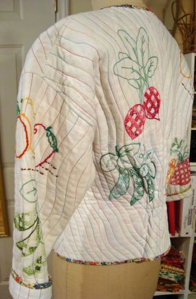 Hand embroidered dishtowels repurposed as a garment.