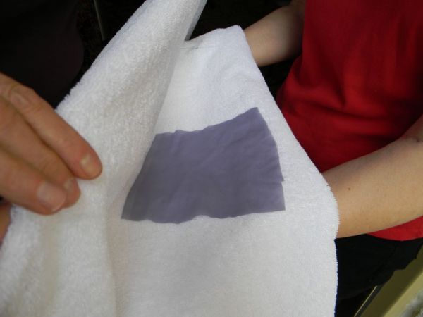 place fabric on towel