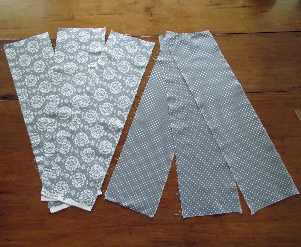 Rip or cut each fat quarter into three 6-inch by 22-inch pieces