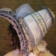 Side view of French Bibi Bonnet This hat would have been worn to accommodate the hairstyle known as the Apollos knot.
